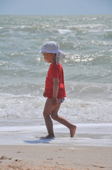 two-year-old boy run on the beach