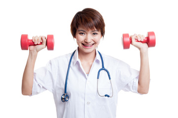 Young Asian female doctor with dumbbells in both hands.