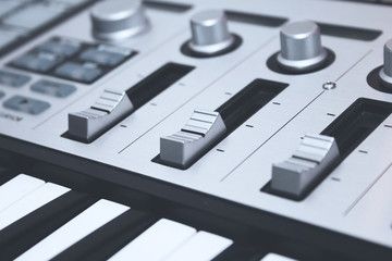 Close up MIDI Controller, keys  and faders