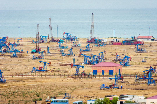 Oil pumps and rigs by the Caspian coast