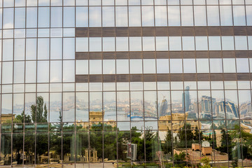 Fototapeta na wymiar Reflection of Baku in the Flame towers