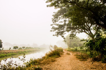 Fototapeta na wymiar road and canal in countryside of chiangmai Thailand