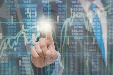 Businessman pointing the trading graph of stock market on the vi