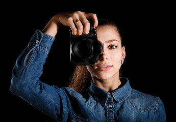 Young girl with a camera