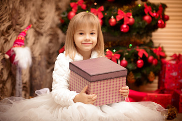 child holding a magic Christmas gift box 