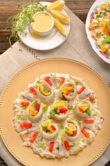 Rolled herrings with fish salad and lemon