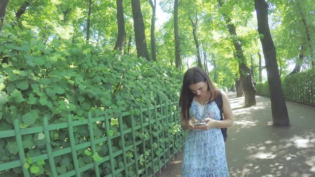 Girl with smartphone in park