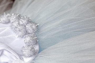 Macro view of sewing dresses. Close Up of fabric mesh for Tutu. Children's dance skirt. Net wedding textile.