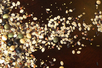Cereals and beans on wood background