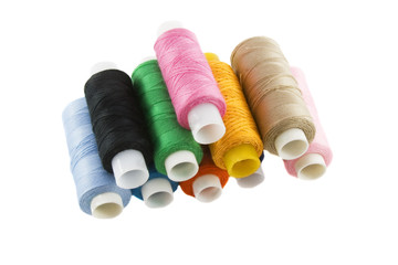 Many colorful threads over the white background