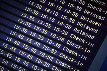 Flights information board in airport terminal