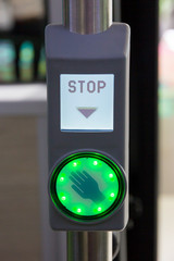 Illuminated bus stop button