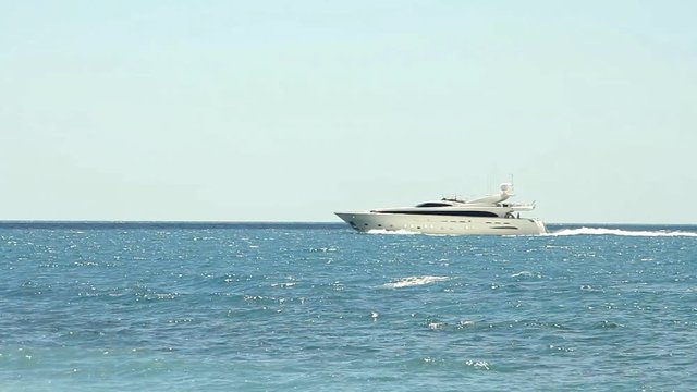 Luxury white speed yacht in open waters

