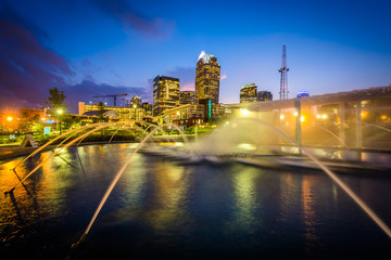 Fountains and the Charlotte skyline at First Ward Park at night,