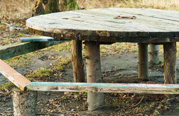 Handmade, table in the woods. Round table on the street.