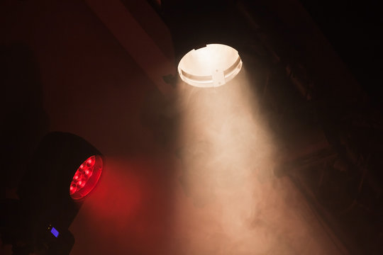 Stage spot lights with smoke in beams