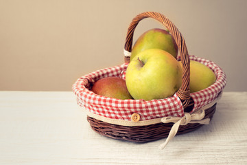 Apples in the basket on the table horizontal