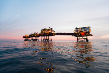 Fototapeta na wymiar Silhouette of offshore oil installation 
