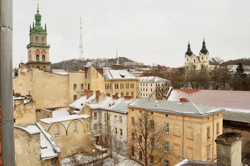 Old buildings and snow-covered roofs of the downtown in Lviv, Ukraine.