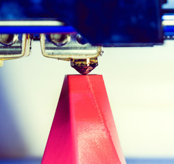 Modern 3D printer printing figure close-up macro.Automatic three dimensional 3d printer performs...