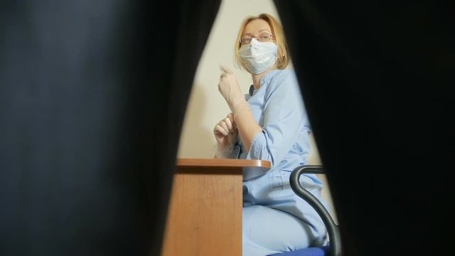 a man is examined by a doctor of the urologist. woman doctor. inspects