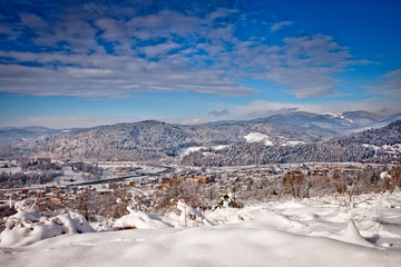 Słoneczny zimowy dzień w górskim mieście Muszyna. Sunny winter day in the mountain in Muszyna - Poland.  Polish mountain landscape   © rogozinski