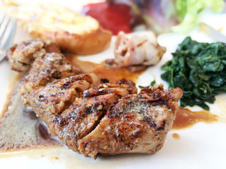 grilled steak with bacon and Spinach