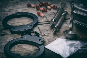 Hard drugs on wooden table