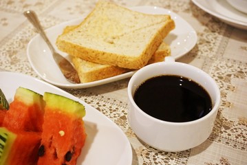 Healthy breakfast with black coffee no sugar, bread and watermelon fruit 