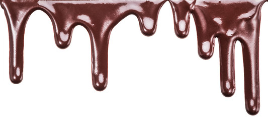 Flowing chocolate drops or drops of chocolate glaze isolated on
