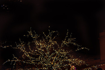 Light colored Christmas decorations at night the streets of Wars