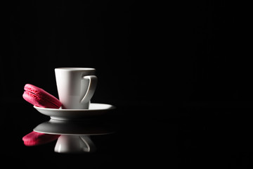 Cup of coffee on black background