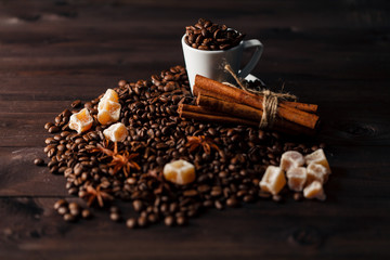 White small coffee cup filled with freshly roasted dark coffee b