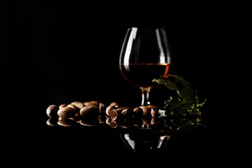 Fotobehang sherryglazen op een donkere achtergrond met veel kopieerruimte © Andrey Cherkasov