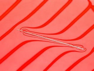 Physical experiment - needle floats on water surface.