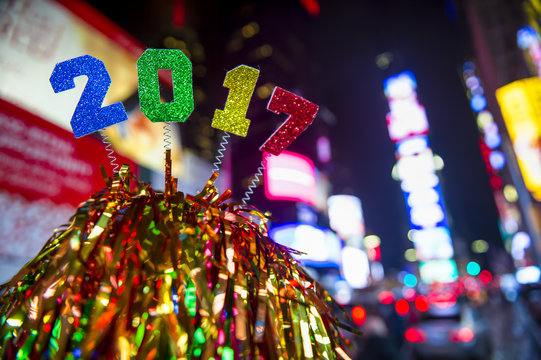 Colorful New Year 2017 message atop celebratory colorful decoration in Times Square, New York City