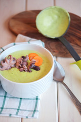 Cream soup with octopus and vegetables