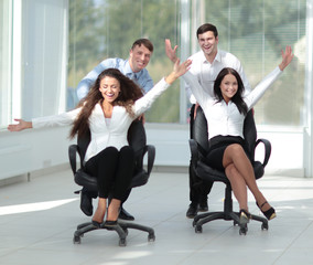 Fototapeta premium happy group of business people rejoicing success in business.