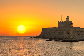 The sunrise at the old port of Rhodes, Greece
