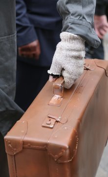 old leather suitcase and the broken glove