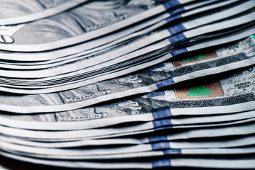 money on a wooden background. lot 100 dollars, business composition