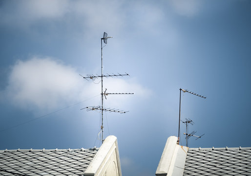 Old antenna for television with blue sky background, Silhouetted image