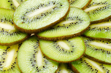 sliced tropical fruit kiwi closeup on a white background