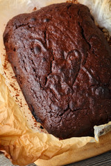 Chocolate cake closeup on paper
