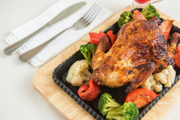 Roasted chicken with vegetables.