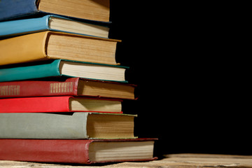 Old antique books on brown wooden table