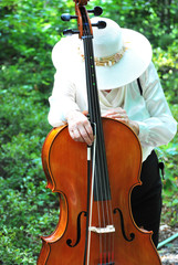 Mature female cellist expressions outside.