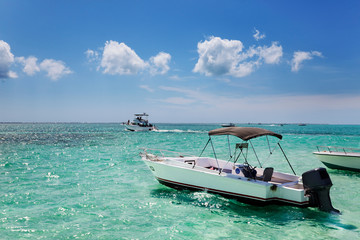 Boats anchored by the sandbar at Stringray City, Grand Cayman