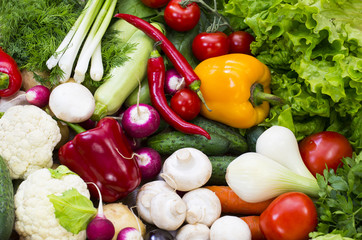 Background of fresh vegetables and greens closeup