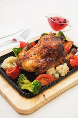 Roasted chicken with vegetables.